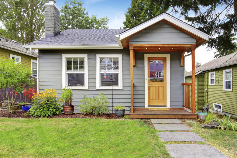 Small American house with gray exterior paint.