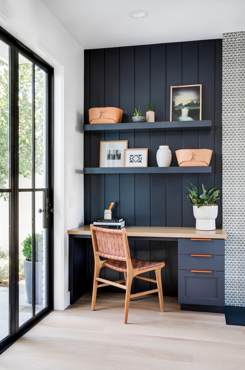 blue home office nook with an accent wall in a white room