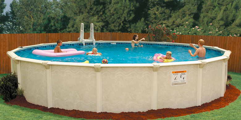 Family enjoying above-ground swimming pool.