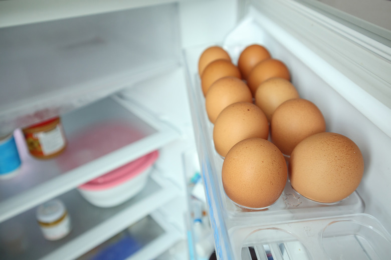 eggs arrange on refrigerator shelf