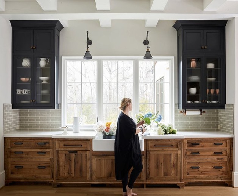 traditional kitchen cabinet doors with black upper cabinets, wood lowers, and a farmhouse sink