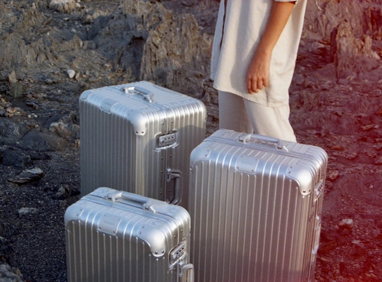 three rimowa suitcases