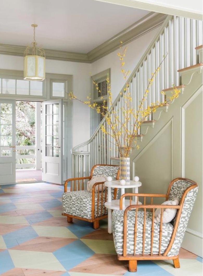 Entryway with colorful floor and chairs