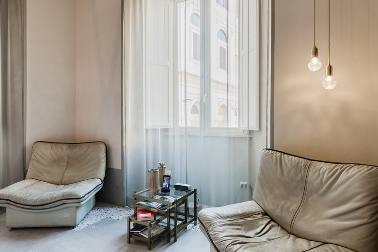 champagne painted walls in room with sheer curtains