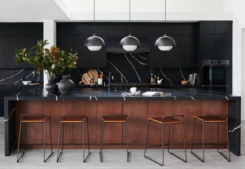 modern black and wood kitchen with black kitchen appliances