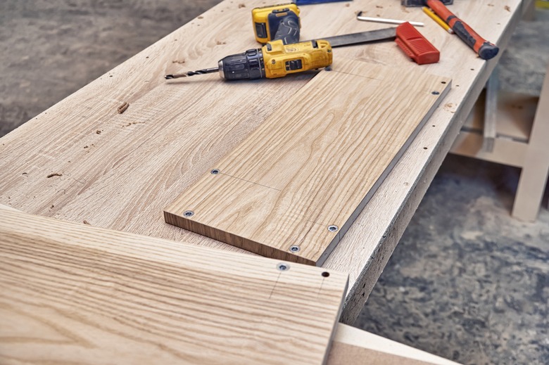 Veneered MDF panels with fittings in the workshop