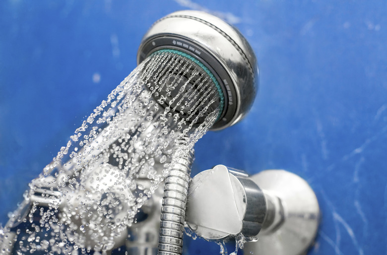 shower head is spraying water.