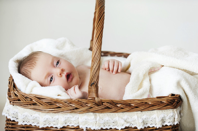 Baby in wicker basket.