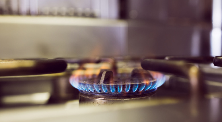 Burning gas on kitchen gas stove