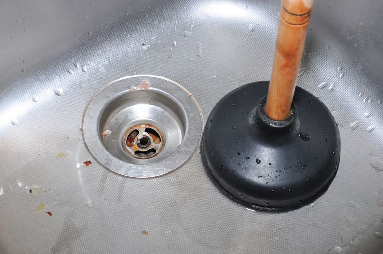 Plunger and kitchen sink.