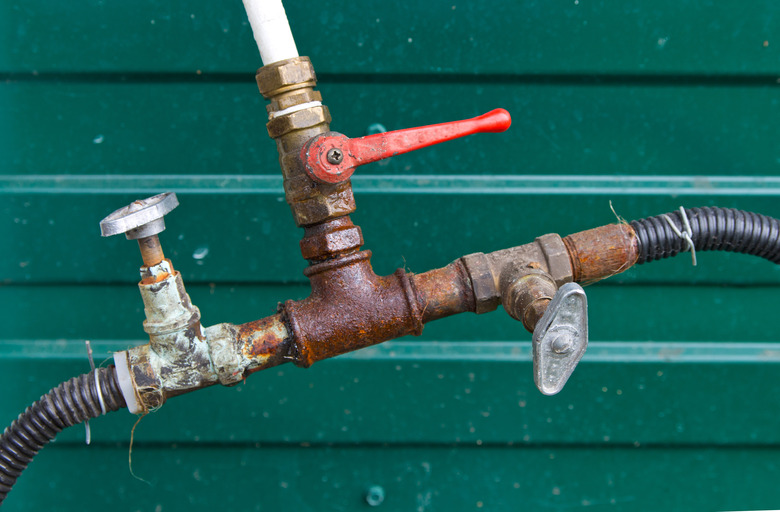 Connection hoses, old rusty plumbing valves