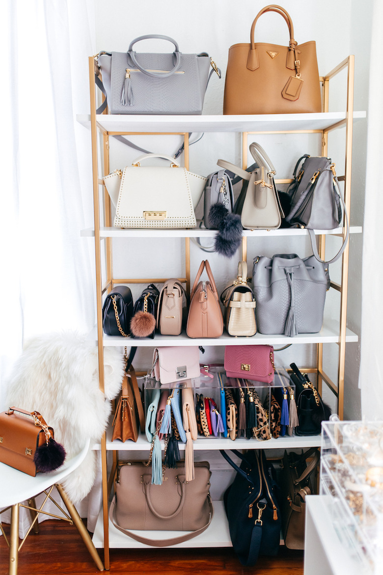 handbag storage on brass bookcase