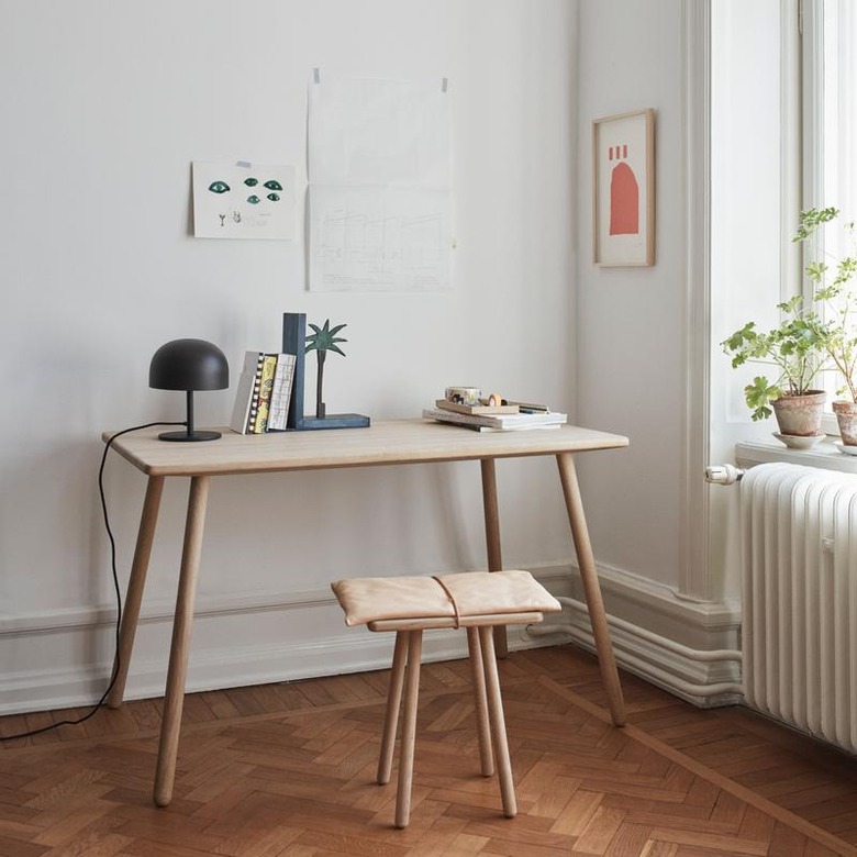 white Scandinavian home office with sleek desk and stool