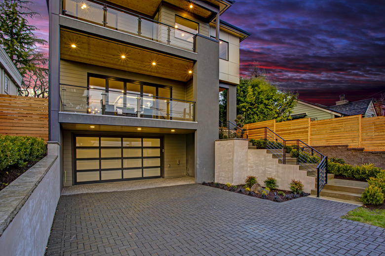 Luxury modern home exterior at sunset