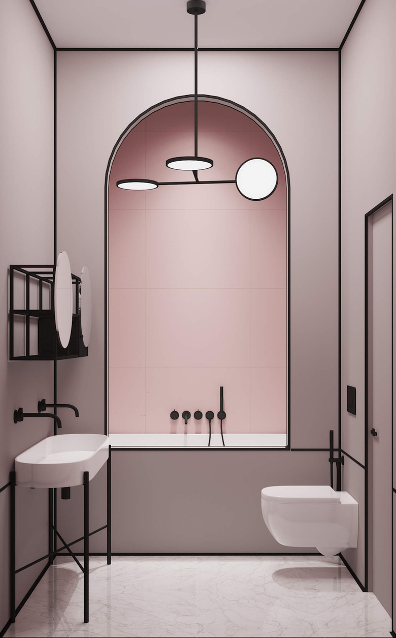 modern bath and shower fixtures in pink and black minimalist bathroom with archway framing the shower