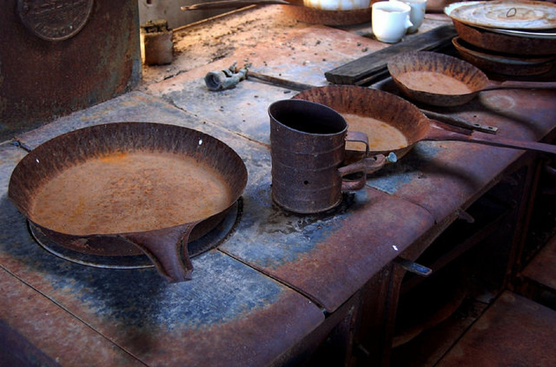 Old cast iron frying pans and stovetop.