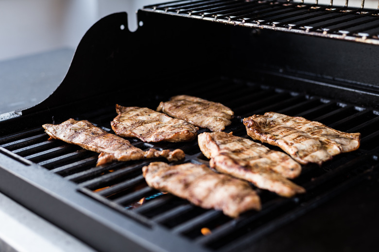 Grilling marinated turkey breast on a gas babrbecue