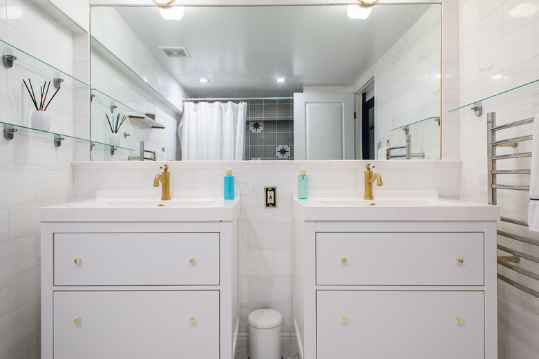 Straight on shot of double vanity sinks and mirror in stylish bathroom