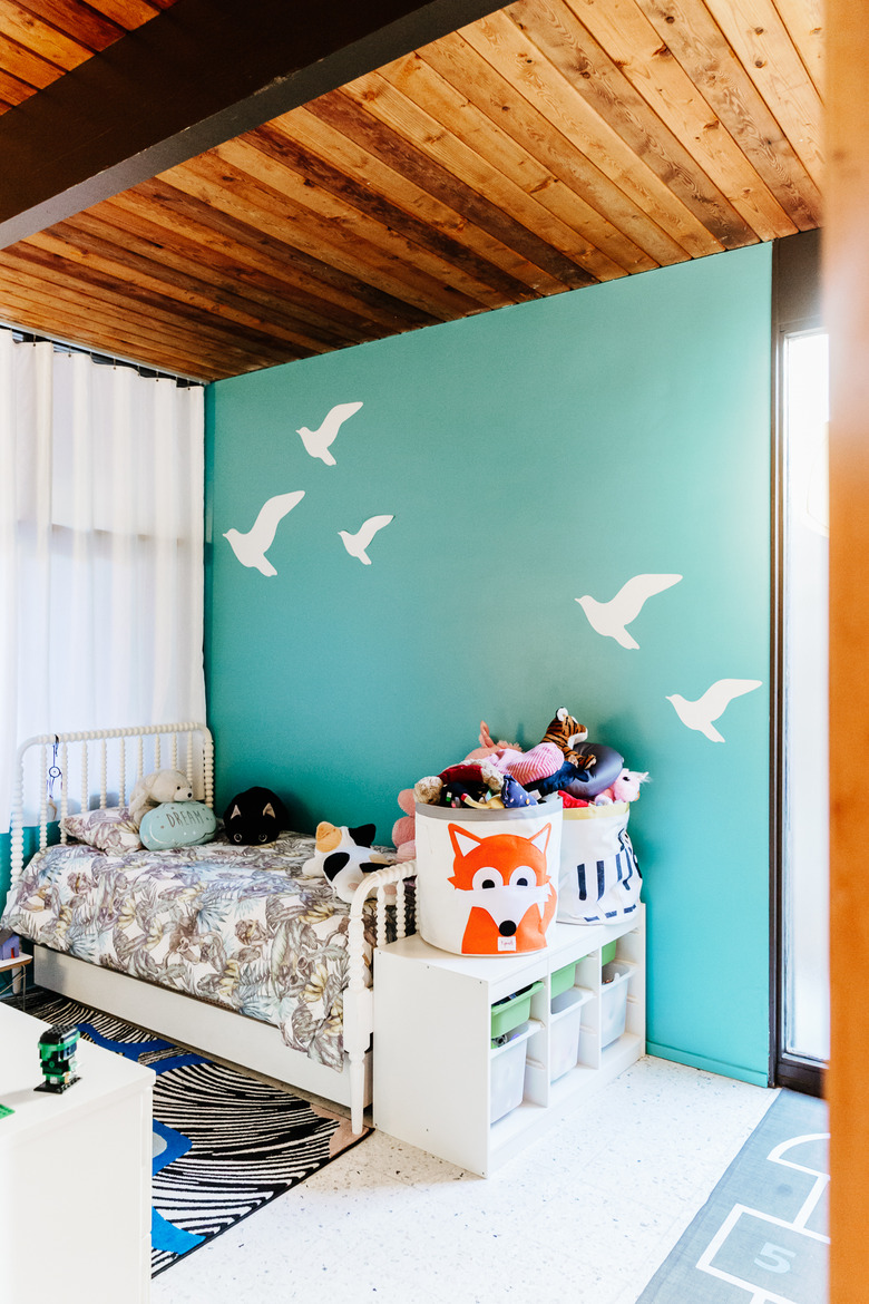 kids bedroom with aqua feature wall