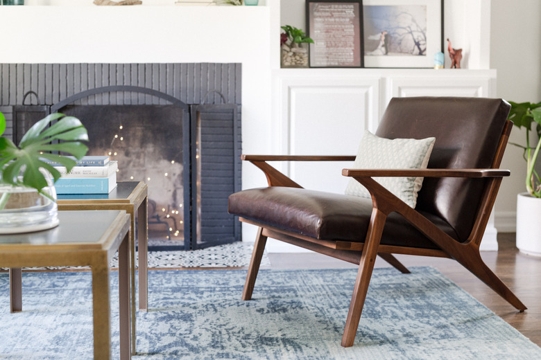 close up of mid century modern accent chair on accent carpet