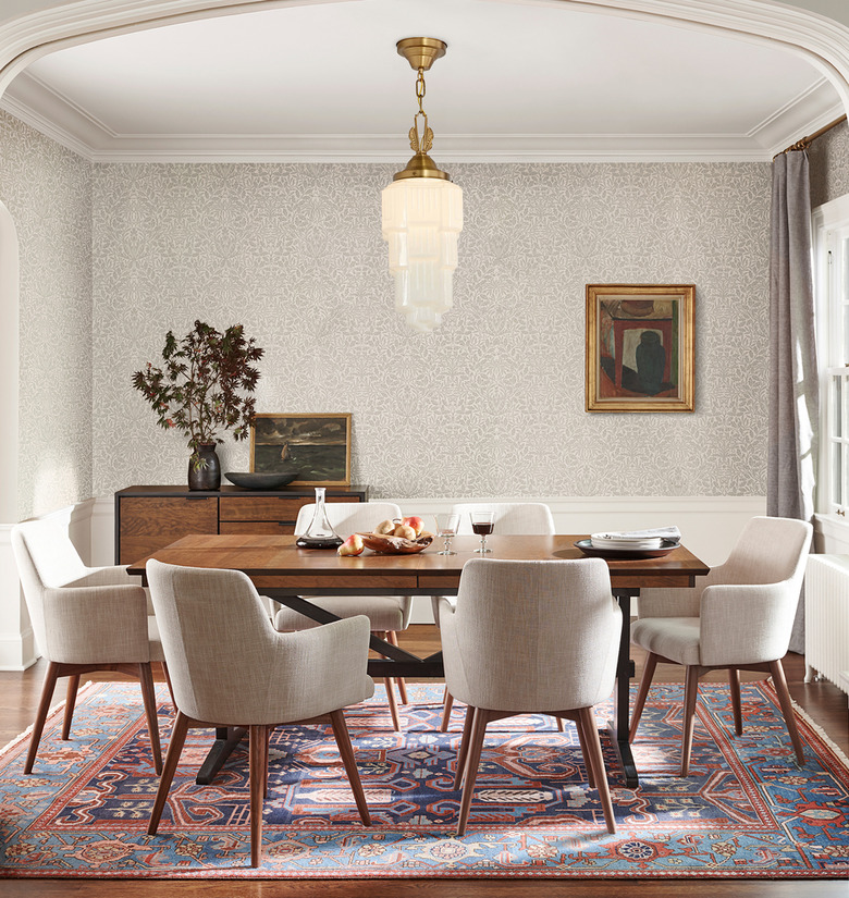 Art deco lighting in dining room with modern table and chairs