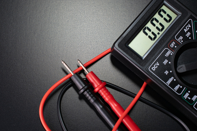 multimeter, electrician tools on black background, digital multimeter on black background