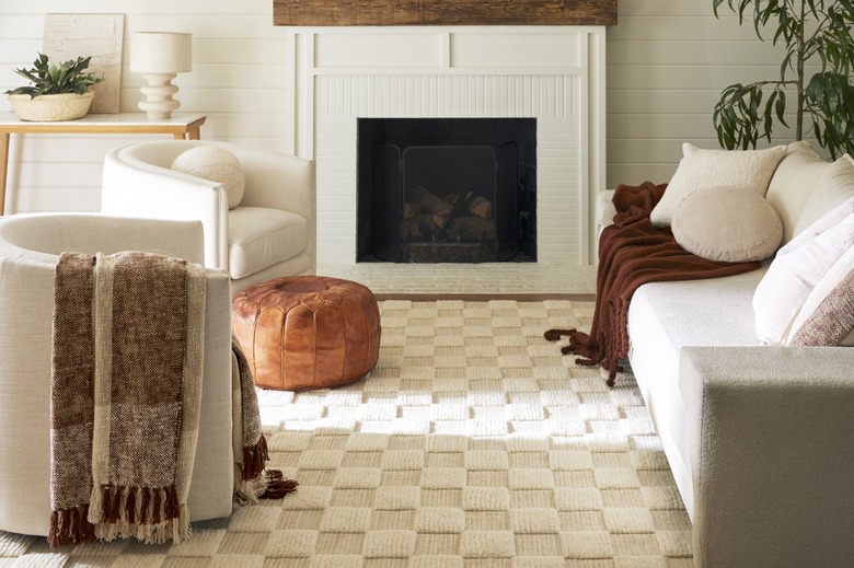 A living room with white furniture