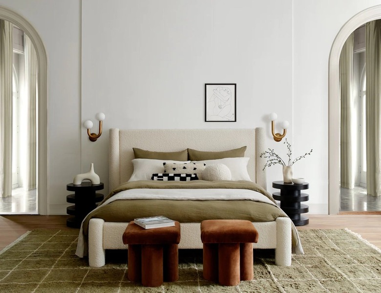 green and cream bedroom with green gridded rug