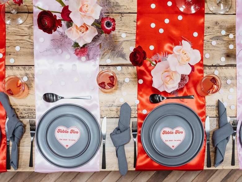 pink and red table setting with florals