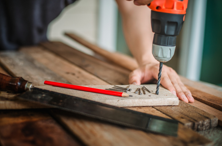 Drilling board with portable drill.