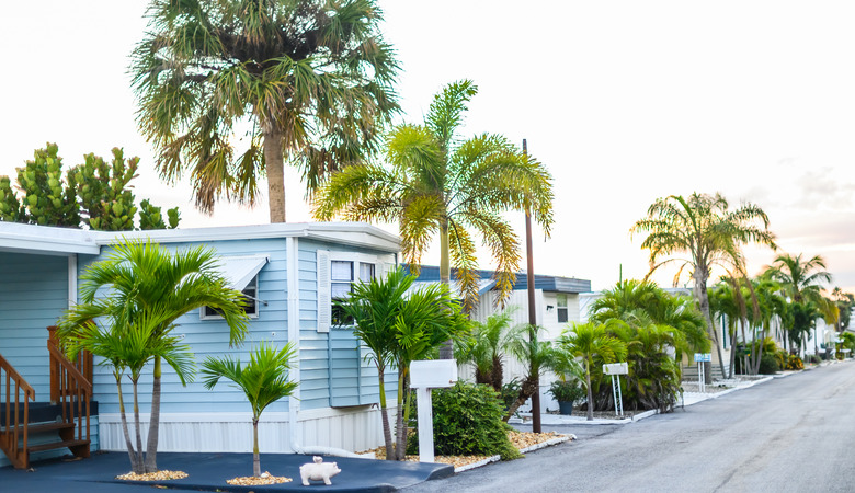 Trailers or mobile homes in a sunny suburban community neighborhood