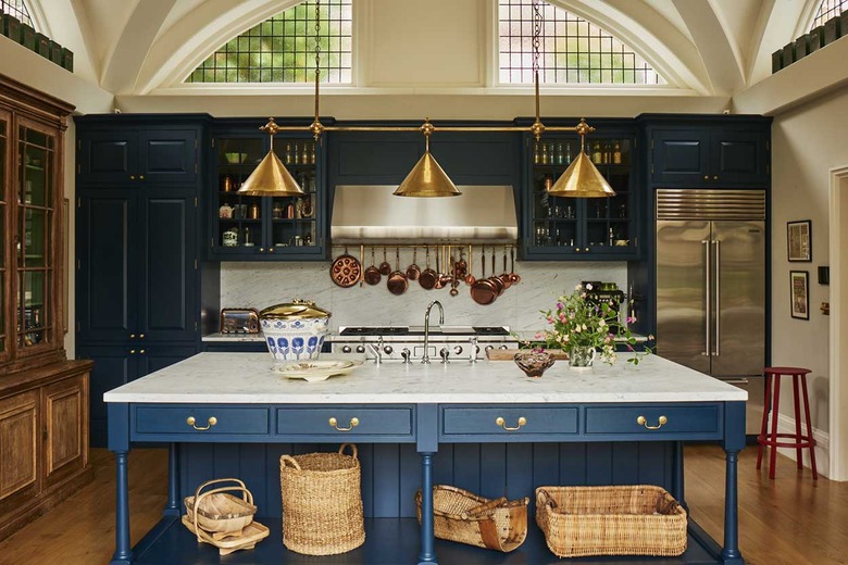 arts and crafts kitchen with blue island and brass light fixture