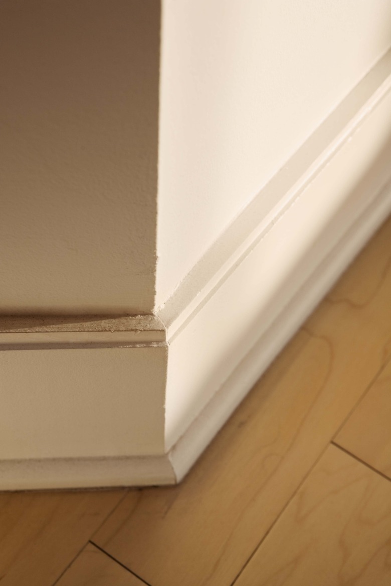 Baseboard and wooden floor