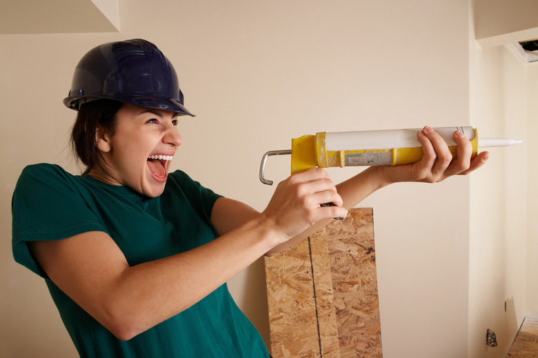 Woman with caulk