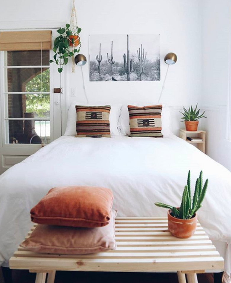 White-dominant minimal bedroom with southwestern accents