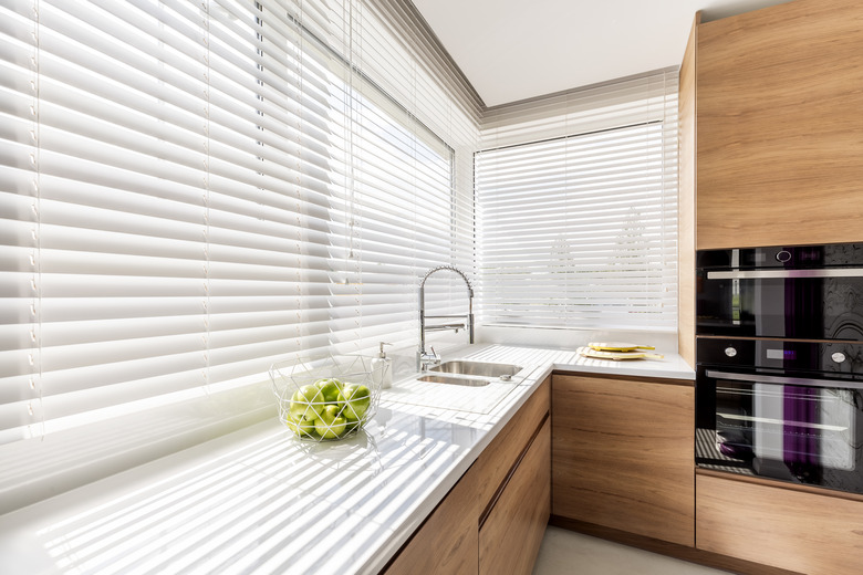 Kitchen with white window blinds