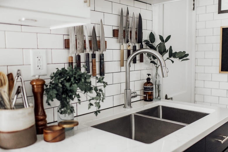 modern kitchen with white subway tile and double sink