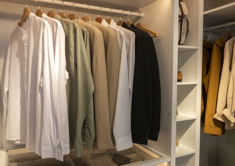 Open closet with shirts