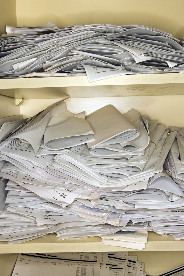 Papers and documents on shelves