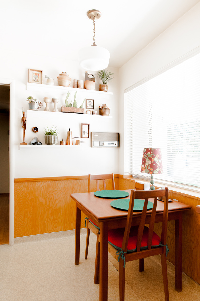 wood dining room wainscoting in small space near large window