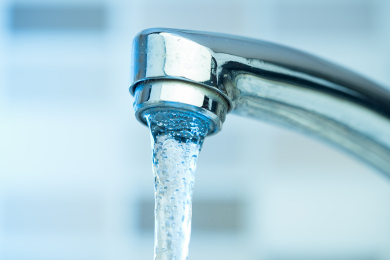 Pouring water from a Faucet