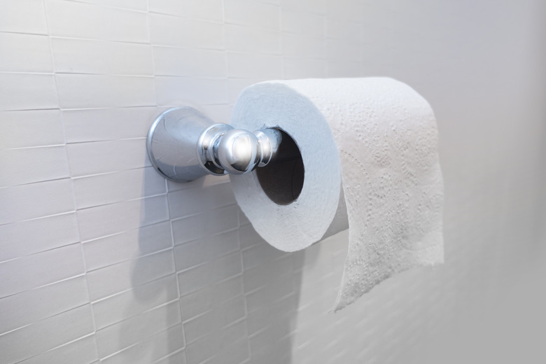 Toilet paper roll on wall bathroom