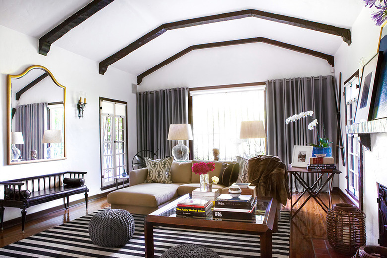 white living room with exposed beams and rustic glam decor