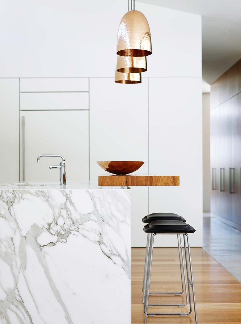 two-tier kitchen island with marble and wood