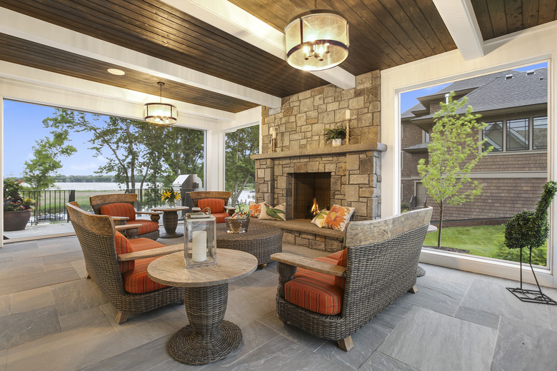 Dark and white wood ceiling over patio of new home