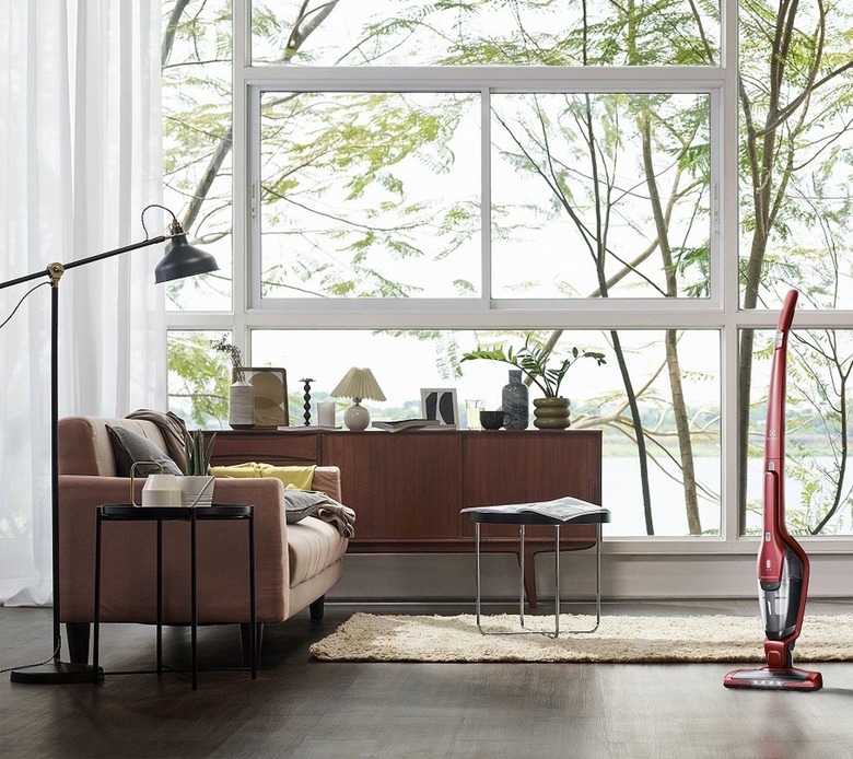 vacuum on hardwood floor in living room