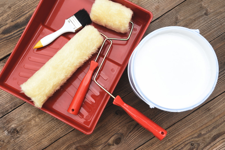 Painted tool with roller paint brush paint bucket canned paint