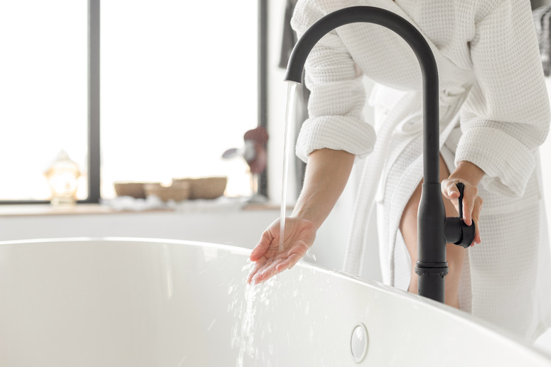 Turning on the water of bathtub at home