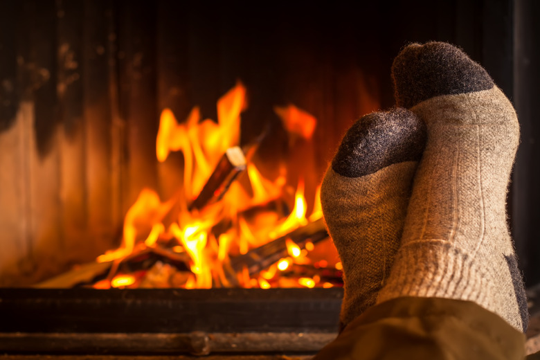 warming feet at fireplace