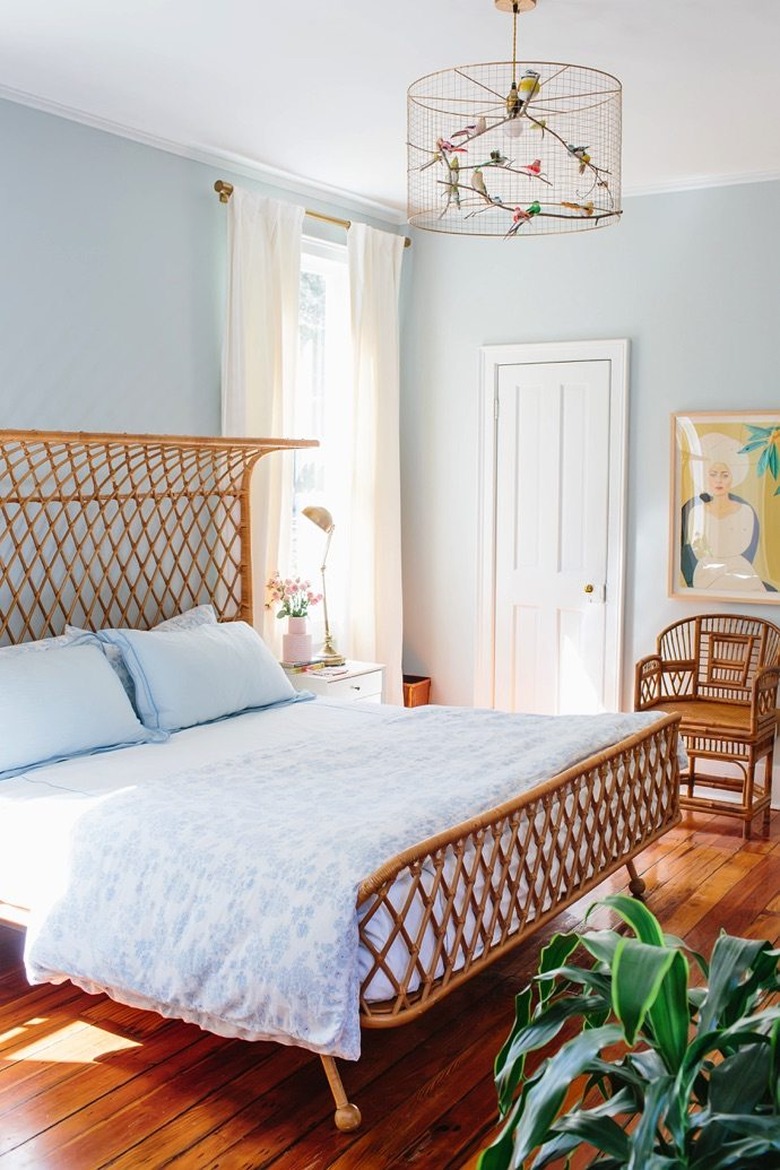 Light blue bedroom with woven rattan bed